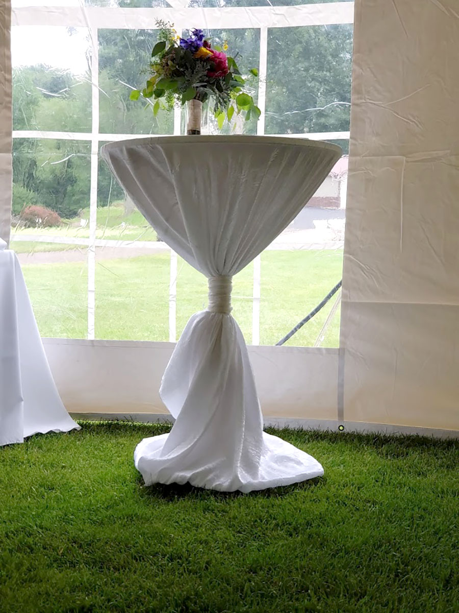 90x156 Iridescent Crush White Tablecover On 30" Round Cocktail Table With Tight Sash Tied On The Center-Oversized Look